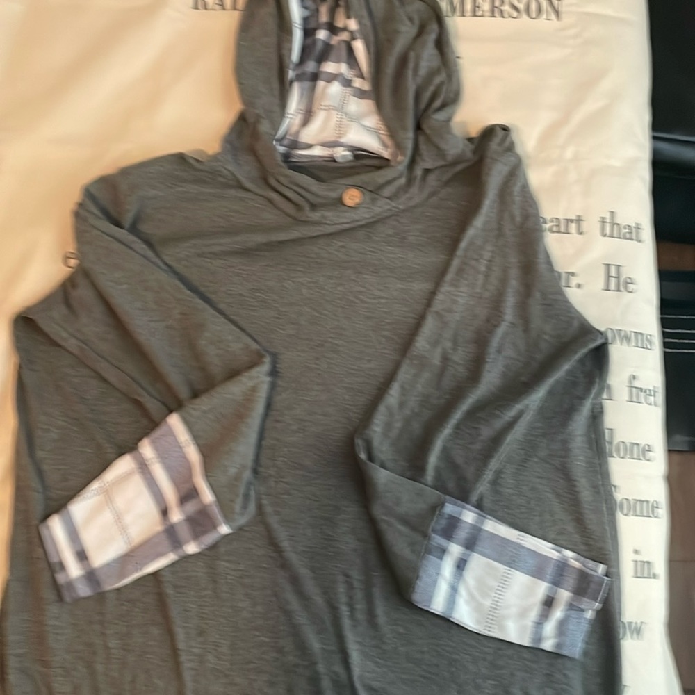 Grey oversized lightweight hoodie with blue and white plaid accents.